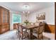 Virtually staged dining room featuring wood table and built-ins at 3651 S Rosalind Ave, Orlando, FL 32806