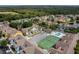 Complex overview showing buildings, pool, and tennis court at 8709 Rockingham Ter # A, Kissimmee, FL 34747