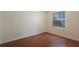 Simple bedroom with wood flooring and window at 8709 Rockingham Ter # A, Kissimmee, FL 34747