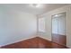 Simple bedroom with hardwood floors and mirrored closet at 8709 Rockingham Ter # A, Kissimmee, FL 34747