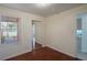 Bright bedroom with wood floors and mirrored closet at 8709 Rockingham Ter # A, Kissimmee, FL 34747