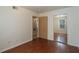 Spacious bedroom with wood floors and mirrored closet at 8709 Rockingham Ter # A, Kissimmee, FL 34747