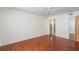 Large bedroom with wood floors and access to bathroom at 8709 Rockingham Ter # A, Kissimmee, FL 34747