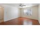Bedroom with wood floors and a window at 8709 Rockingham Ter # A, Kissimmee, FL 34747