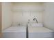 Laundry room with washer and dryer and shelving at 8709 Rockingham Ter # A, Kissimmee, FL 34747