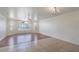 Bright living room with wood-look floors and large window at 8709 Rockingham Ter # A, Kissimmee, FL 34747