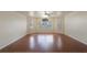 Living room with hardwood floors and a large window at 8709 Rockingham Ter # A, Kissimmee, FL 34747