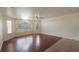 Spacious living room with hardwood floors and large window at 8709 Rockingham Ter # A, Kissimmee, FL 34747