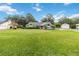 House with a large yard, and mature trees at 1265 Gray Ct, Eustis, FL 32726