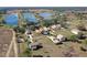 Aerial view of a lakefront community showcasing houses and lots at 20106 Sunset Landing Ave, Groveland, FL 34736