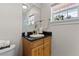 Small bathroom with granite countertop and single sink at 20106 Sunset Landing Ave, Groveland, FL 34736