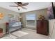 Bright bedroom featuring a ceiling fan and ample natural light at 20106 Sunset Landing Ave, Groveland, FL 34736