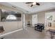 Versatile bonus room with large TV and seating area at 20106 Sunset Landing Ave, Groveland, FL 34736