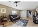 Bonus room features a comfortable leather sofa and built-in cabinets at 20106 Sunset Landing Ave, Groveland, FL 34736