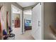 Hallway with barn door and access to bedrooms at 20106 Sunset Landing Ave, Groveland, FL 34736