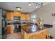 Kitchen boasts granite countertops and stainless steel appliances at 20106 Sunset Landing Ave, Groveland, FL 34736