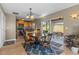 Kitchen with light wood cabinets, granite countertops, and breakfast nook at 20106 Sunset Landing Ave, Groveland, FL 34736