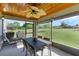 Relaxing screened porch overlooking a spacious backyard at 20106 Sunset Landing Ave, Groveland, FL 34736