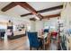 Open concept dining room with exposed beams and view into living room at 2021 Sunderland Rd, Maitland, FL 32751