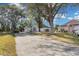 House with driveway and surrounding trees at 2080 Cobblefield Cir, Apopka, FL 32703