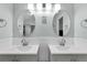 Updated bathroom, double vanity, and stylish light fixtures at 2080 Cobblefield Cir, Apopka, FL 32703
