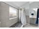 Bathroom with walk-in shower, pebble flooring, and updated vanity at 2080 Cobblefield Cir, Apopka, FL 32703