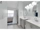 Modern bathroom with double vanity and walk-in shower at 2080 Cobblefield Cir, Apopka, FL 32703