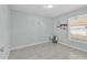 Spacious bedroom with tiled floors and large window at 2080 Cobblefield Cir, Apopka, FL 32703