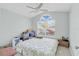 Bright bedroom with a large window and ceiling fan at 2080 Cobblefield Cir, Apopka, FL 32703