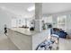 Kitchen island with granite countertop and blue cabinets at 2080 Cobblefield Cir, Apopka, FL 32703
