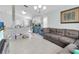 Spacious living room with L-shaped sofa and access to backyard at 2080 Cobblefield Cir, Apopka, FL 32703