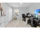 Home office with two computer monitors and built-in desk at 2080 Cobblefield Cir, Apopka, FL 32703