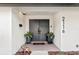 Modern front entry featuring double doors and potted plants at 2116 Alameda St, Orlando, FL 32804