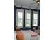 Bright bedroom featuring three windows and a window seat at 2293 Eldorado Ct, St Cloud, FL 34771