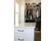 Large walk-in closet with island and hanging clothes at 2293 Eldorado Ct, St Cloud, FL 34771