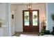 Inviting entryway with double doors and wood floors at 2293 Eldorado Ct, St Cloud, FL 34771