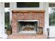 Brick fireplace with wood burning stove, perfect for ambiance at 2293 Eldorado Ct, St Cloud, FL 34771