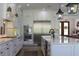 Modern kitchen with stainless steel appliances and white cabinetry at 2293 Eldorado Ct, St Cloud, FL 34771