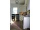 Bright laundry room with white cabinets and stainless steel appliances at 2293 Eldorado Ct, St Cloud, FL 34771