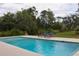 Inviting swimming pool surrounded by lush landscaping at 2293 Eldorado Ct, St Cloud, FL 34771