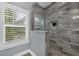 Modern bathroom with a large walk-in shower and granite vanity at 2517 Ridge Ave, Orlando, FL 32803