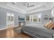 Main bedroom with ensuite bathroom, wood floors and ceiling fan at 2517 Ridge Ave, Orlando, FL 32803