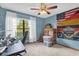 Spacious bedroom with large window and ceiling fan at 3007 Fayson Cir, Deltona, FL 32738