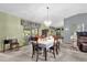 Dining room with chandelier and table set for dinner at 3007 Fayson Cir, Deltona, FL 32738