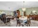 Bright living room features a dining area, comfy seating, and a beautiful chandelier at 3007 Fayson Cir, Deltona, FL 32738