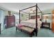 Spacious main bedroom featuring a four-poster bed and ample dresser space at 3007 Fayson Cir, Deltona, FL 32738