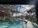 Screened pool and spa overlooking a tranquil lake at 3007 Fayson Cir, Deltona, FL 32738