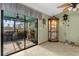 Sunroom with access to backyard and a display cabinet at 3007 Fayson Cir, Deltona, FL 32738