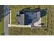 Aerial view of a house, pool and large backyard with detached garage at 3705 Ridge Run Dr, Minneola, FL 34715