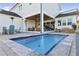 Inviting plunge pool with gray stone coping and surrounding patio at 3705 Ridge Run Dr, Minneola, FL 34715